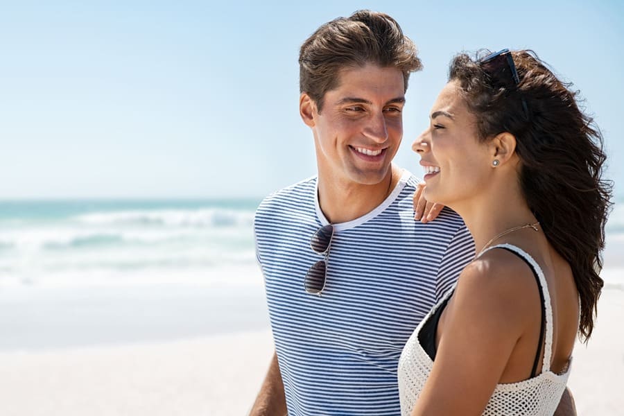 happy young couple at beach